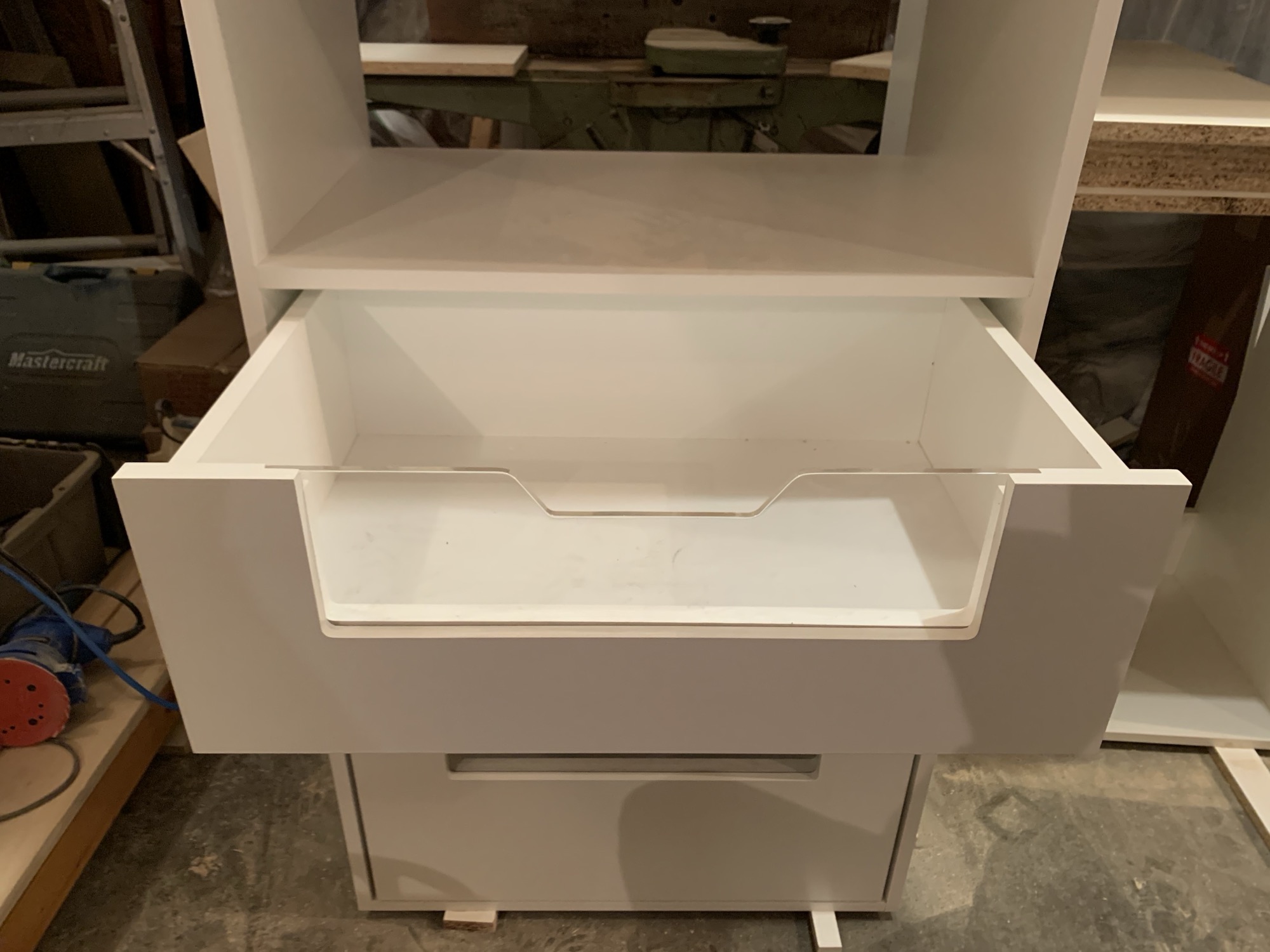 Modern closet with acrylic doors.