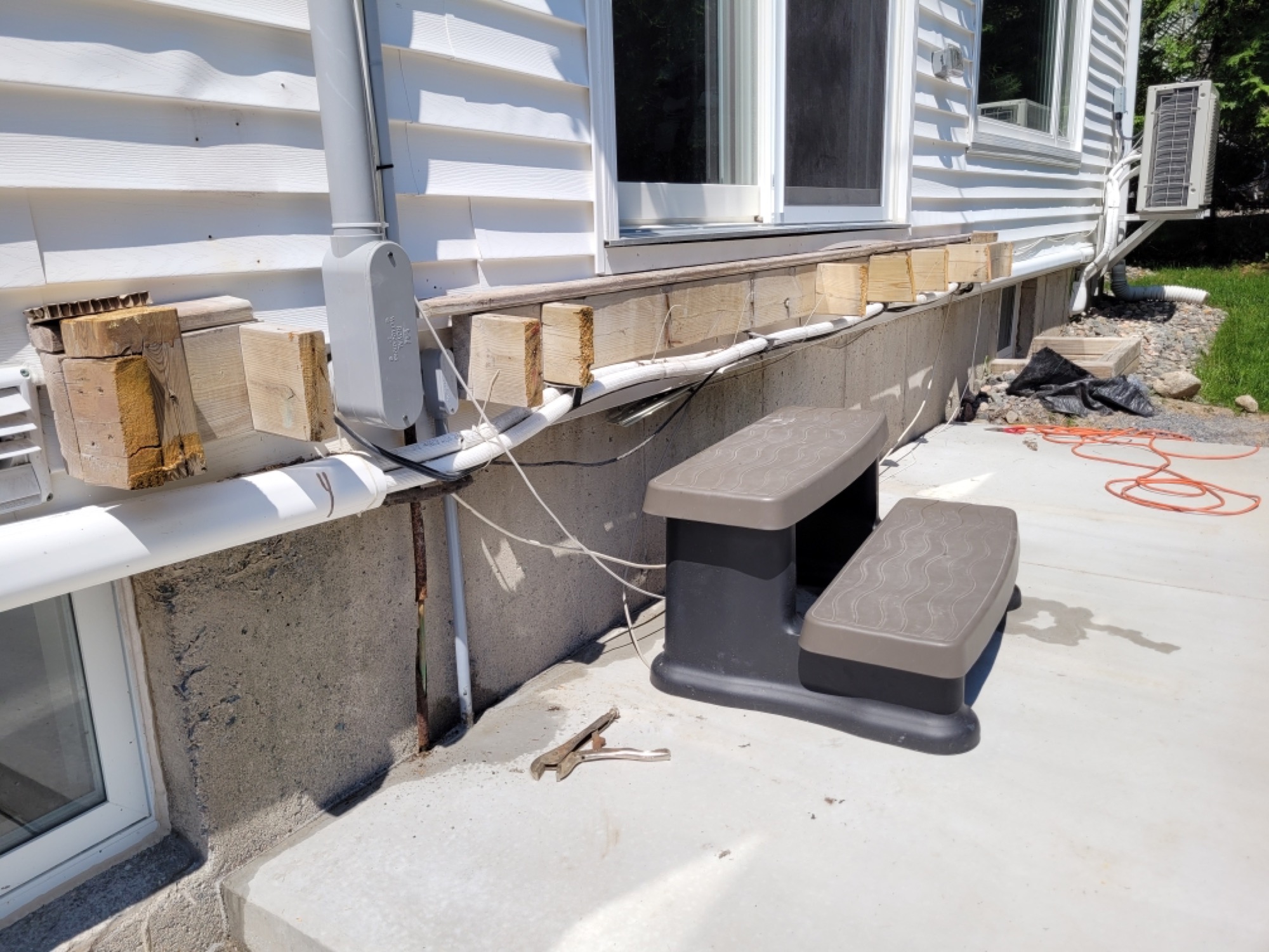 Spacious backyard deck with composite decking - During