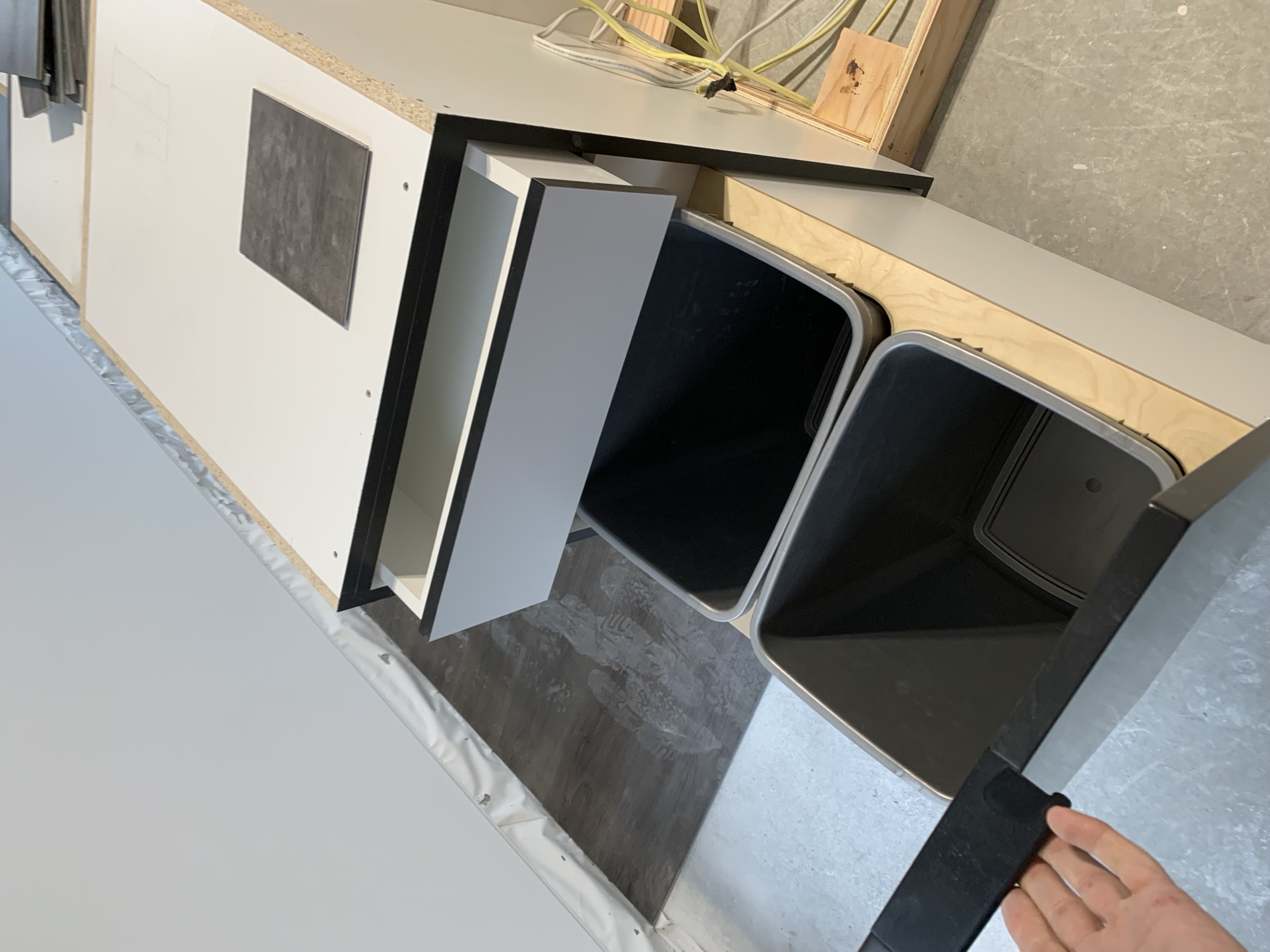 Custom kitchen cabinetry with custom bins.